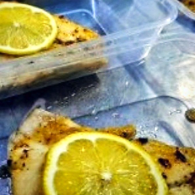 Grilled fish with lemon, packed in crib containers