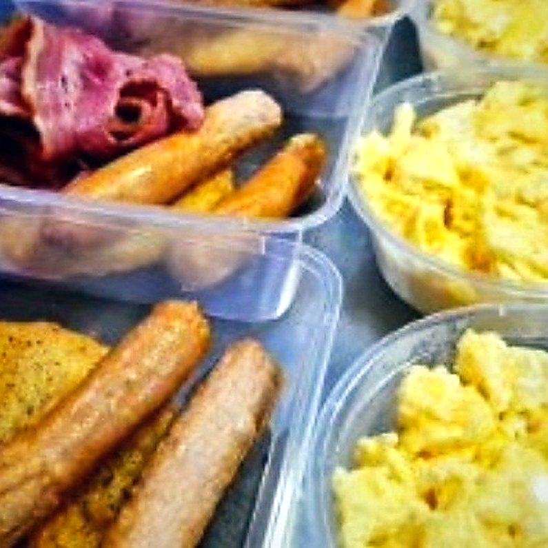Hot breakfast cribs of bacon, sausages, hash browns and scrambled eggs