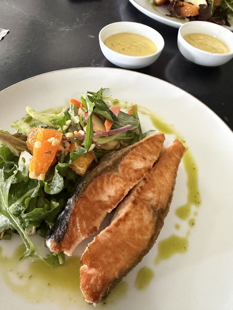 Crispy-skin salmon on a fresh garden salad