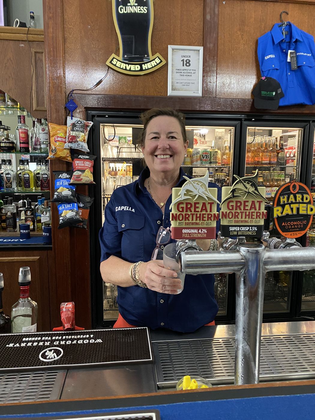 Pouring a beer at the Dooleys Capella bar