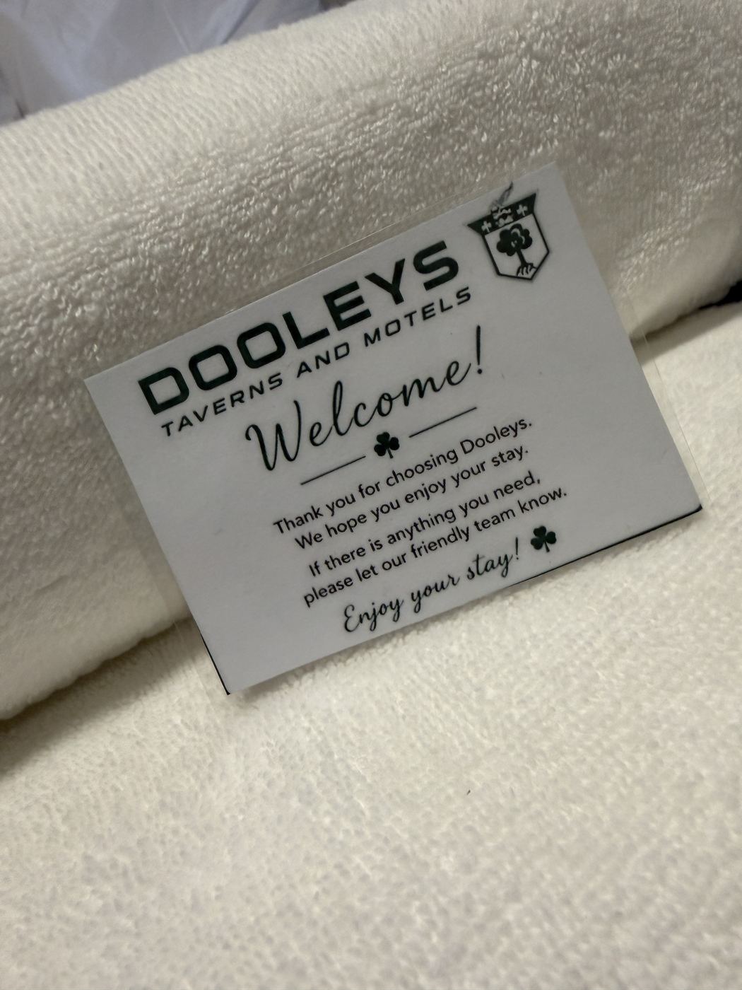 Dooleys welcome card on a fresh towel