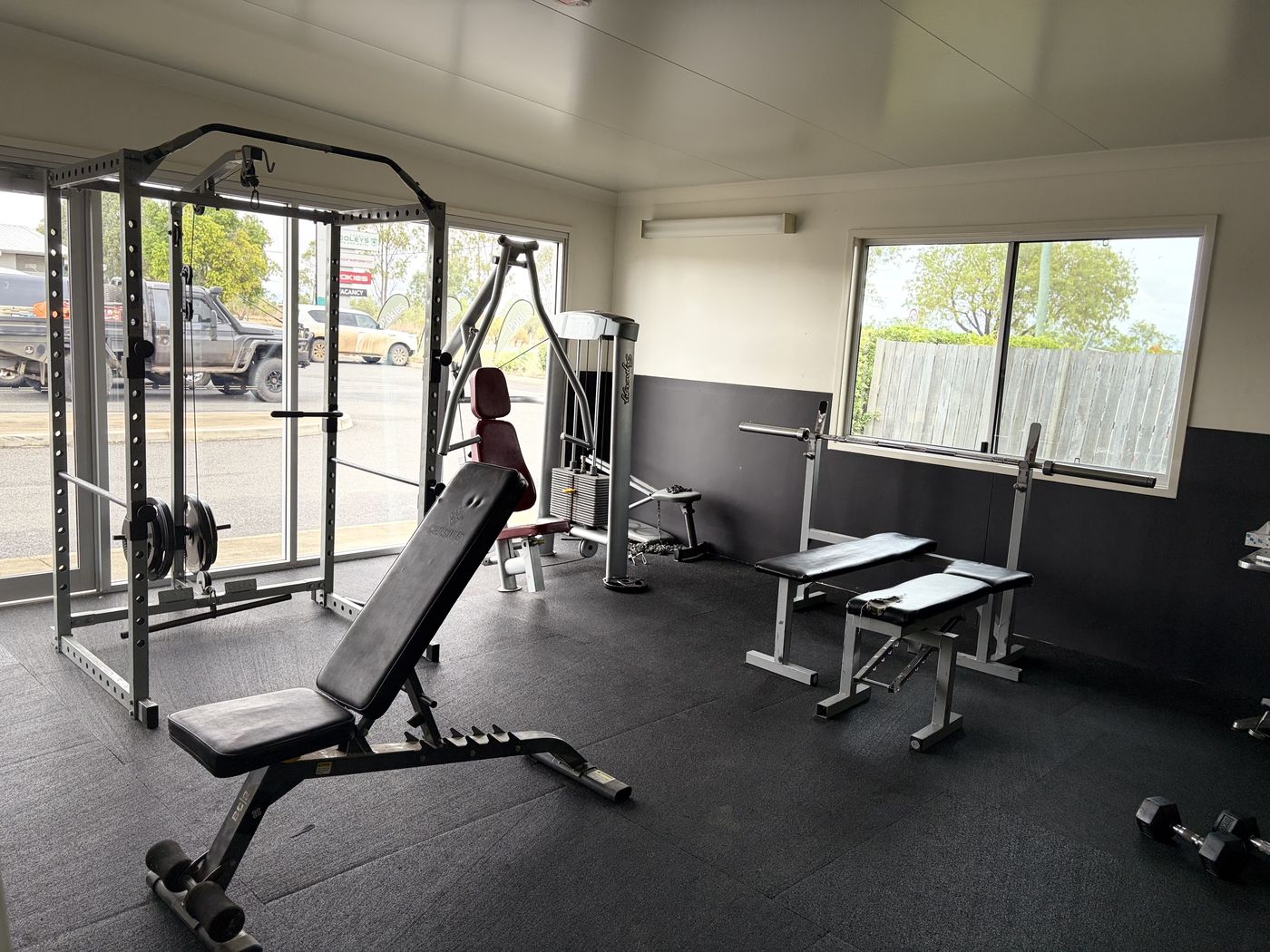 Weights rack, cable machine and adjustable bench in the gym