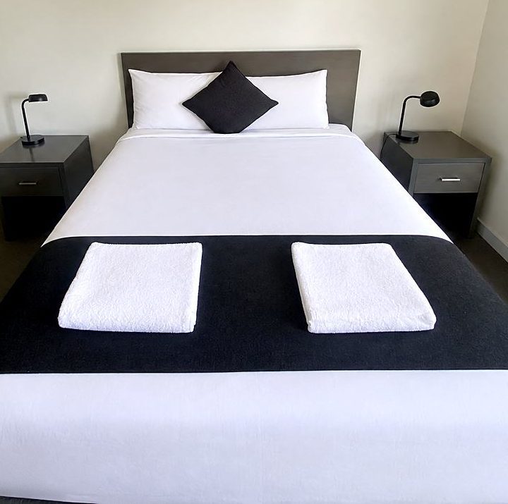 Deluxe Queen room with crisp white linen